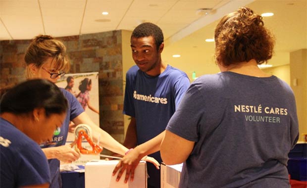 Nestl&eacute; Waters North America employees assemble first aid kits for Americares. Photo courtesy of Nestl&eacute; Waters North America.